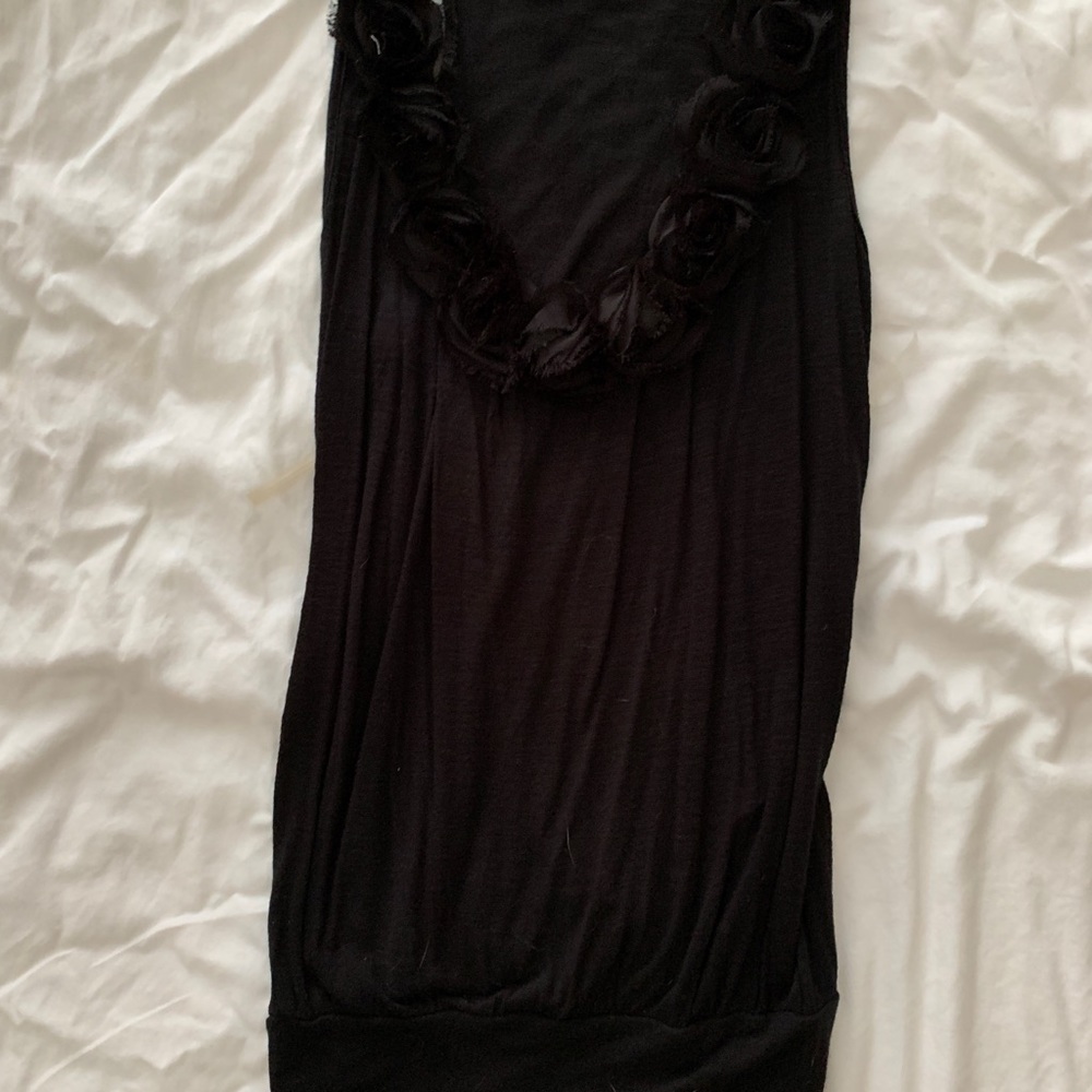 Black sleeveless blouse with flowers around neck